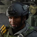 Coffey wearing a helmet and green tactical uniform